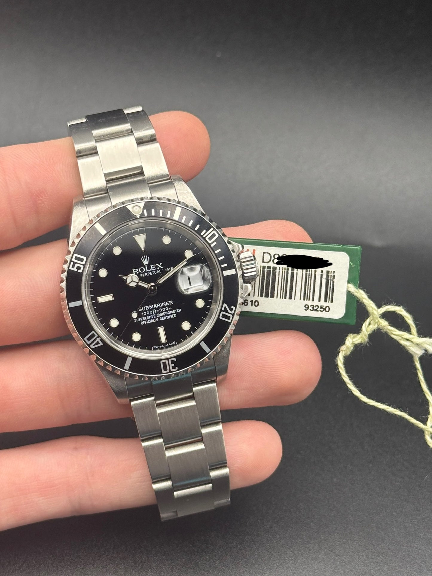 Rolex Submariner Date 16610T D Serial Watch and Hang Tag