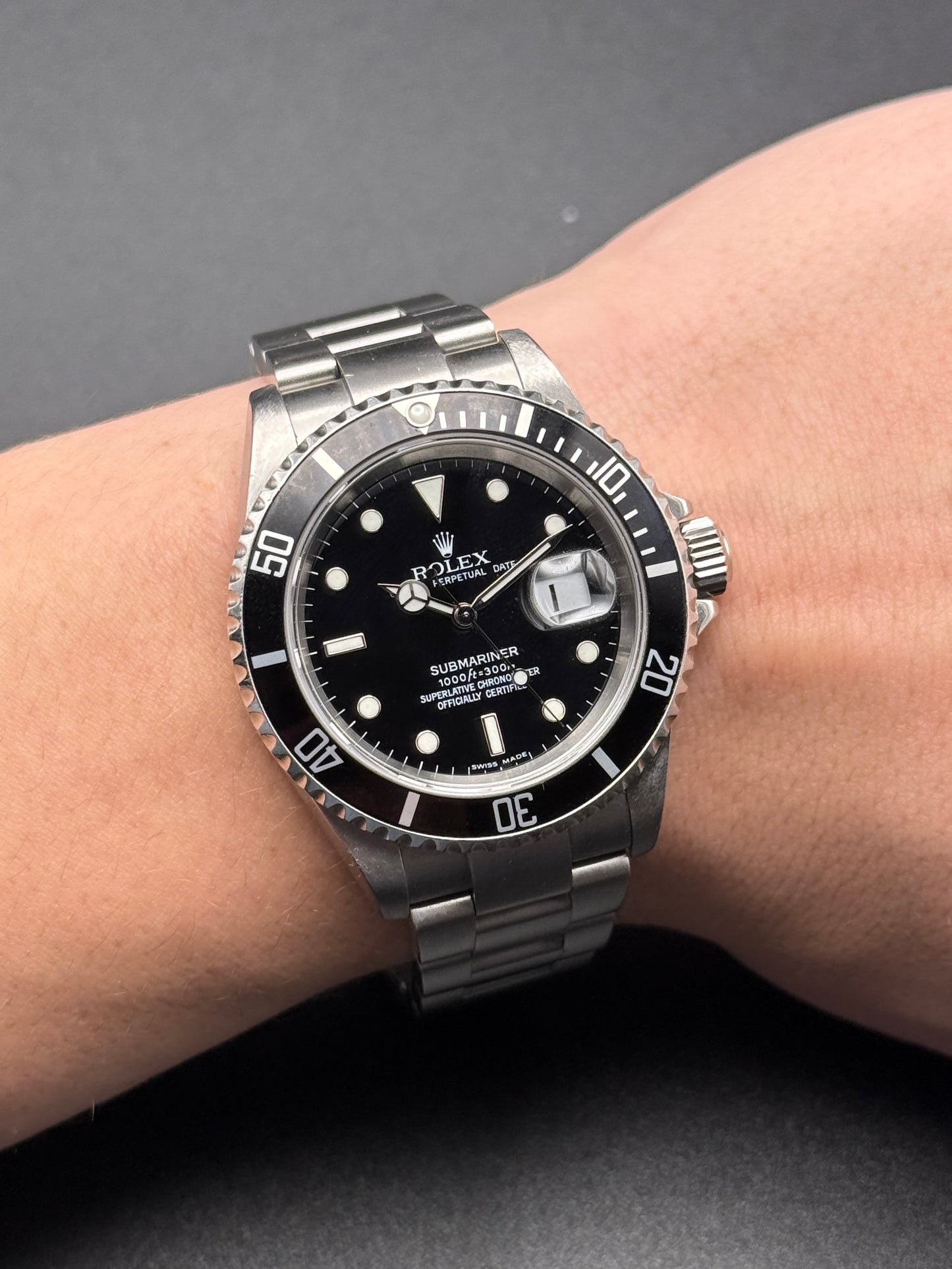 Rolex Submariner Date 16610T D Serial Watch and Hang Tag